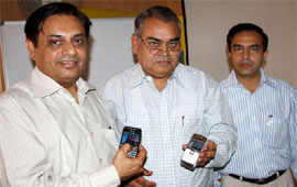General manager of BSNL, Bathinda, Vinod Parkash (Centre), demonstrates a video call at the launching ceremony of the 3-G service in Bathinda on Wednesday. Also seen in the picture are V.K. Ahuja, GM, CMTS, and Pradeep Kumar (right), DGM, Bathinda. 