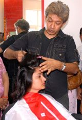 Renowned hairstylist Jawed Habib gives a new hairstyle to a girl during the launch of his professional academy of hair and beauty in Bathinda on Wednesday.