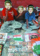 Venders sport Rahul Gandhi masks outside AICC headquarters in 