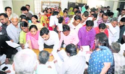 People throng the Election Commission office to register as voters in Gurgaon