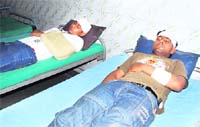 First-year students of the BM College of Technology in a hospital after being allegedly attacked in Farukh Nagar
