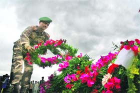 An Army officer lays a wreath on the pyre of martyred soldier Rakesh Sharma in Samba