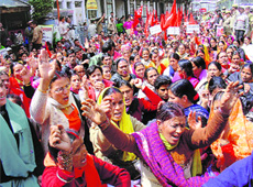 Mid-day meal workers protesting for the acceptance of their demands at Chhota Shimla on Thursday.