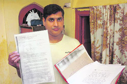 Manzoor Hussain Salaria, son of Abdul Karim Salaria, produces documents to support his claim to land in Jammu on Thursday.