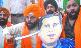 Activists of the National Akali Dal shout slogans against Varun Gandhi for his comments against Sikhs and Muslims, at Jantar Mantar in New Delhi on Friday.