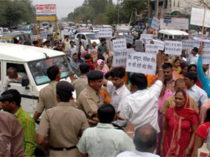 Parents block traffic in protest against fee hike by private schools in Gurgaon on Friday.