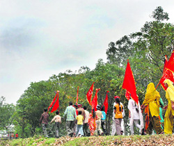 Divine Calling: Pilgrims pass through Karnal on the way to Shri Mahamaya Balasundarji temple in Trilokpur, Himachal Pradesh, on the first day of the Navratra festival on Friday.