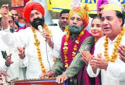 Jaspal Bhatti and his party candidate, “Bhajna Amli”, in Ludhiana on Saturday.