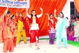 Students of Malwa school perform gidha on the annual day function in Amloh on Saturday.