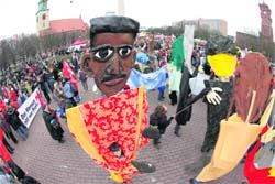 A protester holds a giant puppet of US President Barack Obama (C) during a protest in Berlin on Saturday. Thousands of demonstrators ghathered in Berlin and Frankfurt to protest against globalisation and recession.