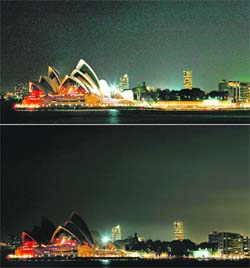 The combo views show the Sydney Opera House with lights on (top) before Earth Hour and then during the hour (bottom photo) in Sydney on Saturday. The waters of Sydney Harbour plunged into darkness at 8.30pm local time, with the iconic Opera House and Harbour Bridge killing their lights for an hour in a global call for action on climate change