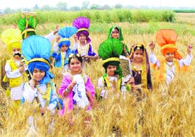 Children learn the basics of bhangra for the forthcoming Baisakhi festival in a field near Ludhiana