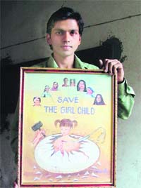Rahul shows his painting that advocates against female foeticide