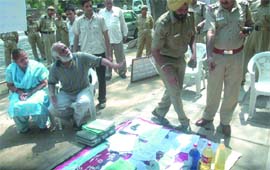 The police takes possession of bottles of petrol and kerosene which were used by ex-army Colonel Balwant Singh in his self-immolation bid at Jantar Mantar in New Delhi on Monday.
