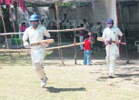 LIC team's opener batsman, enters the field during 2nd Uttarakhand Cup in Dehradun
