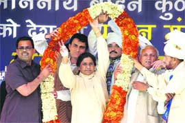 BSP chief Mayawati waves to the crowd before addressing an election rally in Jammu on Monday. 