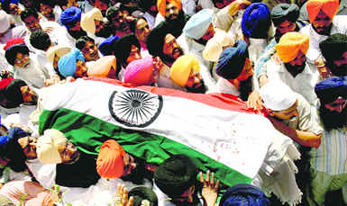 The body of Capt Kanwaljit Singh being taken for the last rites at the cremation ground in Chandigarh on Monday.