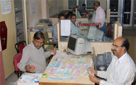 Staff of the Punjab National Bank, Bathinda, busy finishing their work late on Tuesday night, the last day of the financial year 2008-09.