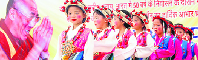 Tibetan girls perform traditional dance at Thanks Giving day celebrations in Dehradun on Tuesday.