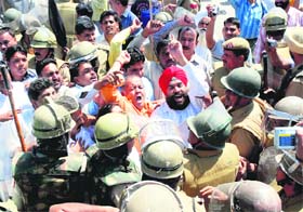Members of the Kalpana Chawla Yadgar Samiti hold a protest in Karnal