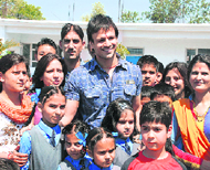 Bollywood star Vivek Oberoi poses with special children at Lawrance Public School, Sidhra, in Jammu on Tuesday.