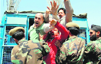 The police arrests activists of the Jammu and Kashmir Democratic Freedom Party protesting against the rearrest of party chief Shabir Ahmed Shah near Central Jail, Srinagar, on Tuesday.