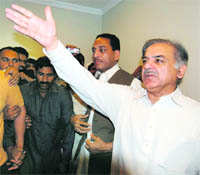 This handout picture released by the Pakistan Muslim League-Nawaz shows opposition leader Shahbaz Sharif greeting supporters in Lahore on Tuesday.