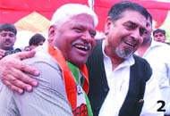 North East candidate Jagdish Tytler hugs party's West Delhi candidate Mahabal Mishra