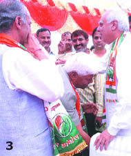 Mahabal Mishra seeks blessings of Chandni Chowk candidate Kapil Sibal while party president