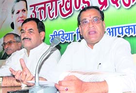 Uttarakhand Congress chief Yashpal Arya and Harak Singh Rawat, Leader of Opposition in the Uttarakhand Assembly address mediapersons