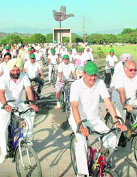 Punjab and Haryana High Court judges take part in a cycle rally in Chandigarh, on Thursday.