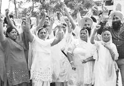 1984 riot victims protest against the orders of the CBI giving a clean chit to Jagdish Tytler at Phase XI in Mohali on Thursday.