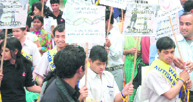 Social activists and autistic children participate in a rally at Gandhi Park in Dehradun on Thursday.