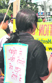 Social activists and autistic children participate in a rally at Gandhi Park in Dehradun on Thursday.