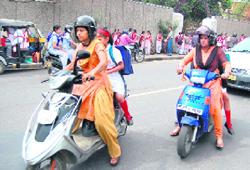 Mothers take away their wards from a school in Dehradun on the first day of the new academic session on Thursday.