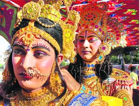A boy dressed as Lord Rama with Sita at a tabluex during a shobha yatra taken out on the eve of Ram Navmi in Ludhiana