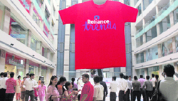People gather to see Indias largest T-shirt at Ambience Mall in Gurgaon on Friday.