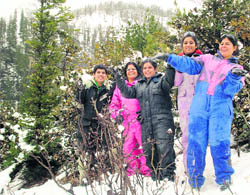 Tourists enjoying in the fresh snowfall at Gulaba, about 19 km from Manali, on the Rohtang Pass road, on Friday. 