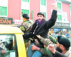 An activist of Jammu and Kashmir Tehreek Hurriyat who was protesting against the detention of party leader Syed Ali Shah Gillani, being taken away by the police in Srinagar on Friday.