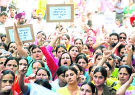 Members of the BEd Teachers’ Front take out a protest march in Ludhiana on Friday.