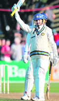 Harbhajan Singh celebrates after scoring a half-century.