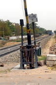 the unlowered bar at the railway crossing