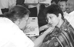 A Congress worker interacts with Kumari Selja during a workers meet held at Panchkula