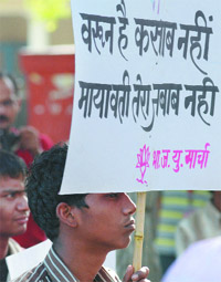 BJP Yuva Morcha activists protest against Uttar Pradesh Chief Minister Mayawati for her remarks on Maneka and Varun Gandhi at Jantar Manter in New Delhi on Saturday.