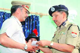 DGP Subhash Joshi honours sub-inspector PM Godbole at a function in Dehradun