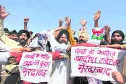 Activists of the Sikh Youth Federation protest against Congress leader Jagdish Tytler in Jammu on Saturday.