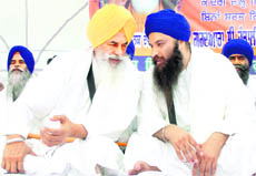 Takht Damdama Sahib Jathedar Balwant Singh Nandgarh (left) in discussion with radical Sikh leader Baljit Singh Daduwal in Jandalisar gurdwara in Bathinda  district
