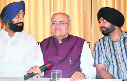 Former Cabinet minister Bikram Singh Majithia, in charge of the state BJP affairs Balbir Punj and BJP candidate for the Amritsar Lok Sabha seat Navjot Singh Sidhu during a press conference in Amritsar