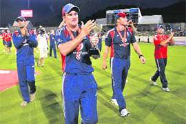 England's captain Andrew Strauss, second left, leads his teammates Andrew Flintoff, second right, Ravi Bopara, left, and Matt Prior while celebrating the victory in the fifth and final one-day international in Gros Islet, St. Lucia, Friday. England defeated West Indies by 26 runs to win the series 3-2.