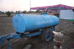 A BMC vehicle being used to sprinkle water at the venue of deputy CM Sukhbir Badals election rally at Kothe Amarpura on Sunday. 